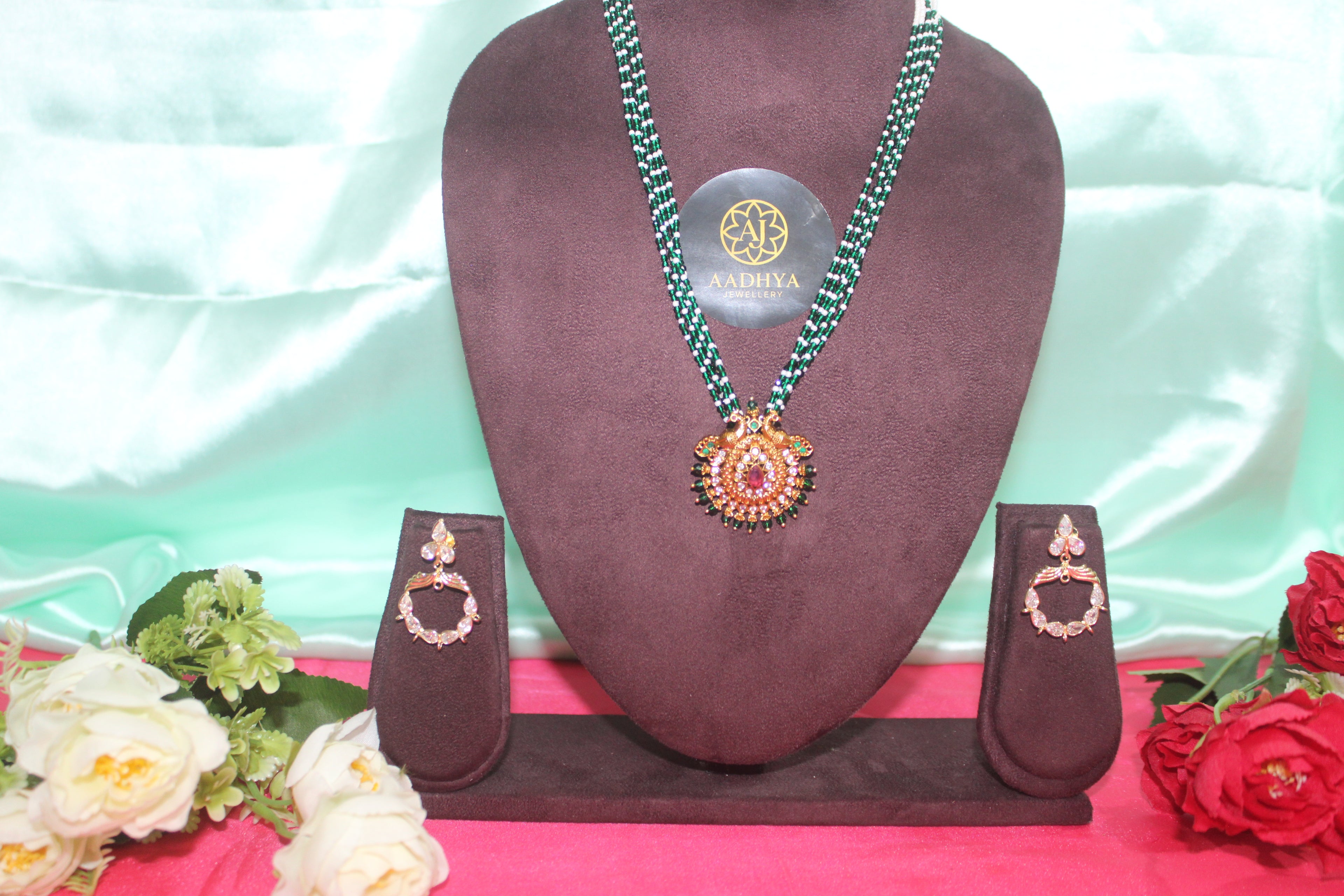 green crystal beads with sugar beads ,peacock pendent matching earings