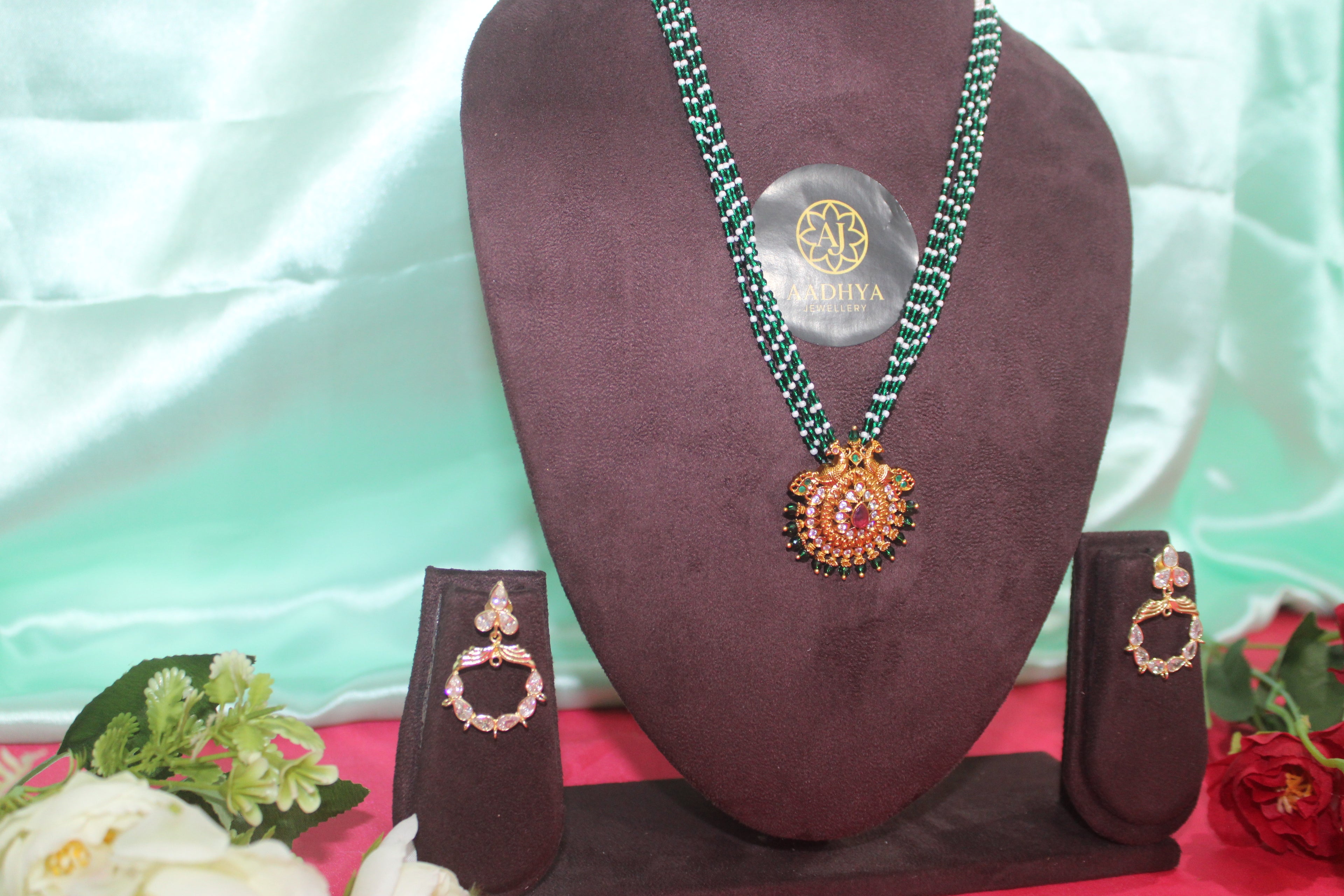 green crystal beads with sugar beads ,peacock pendent matching earings