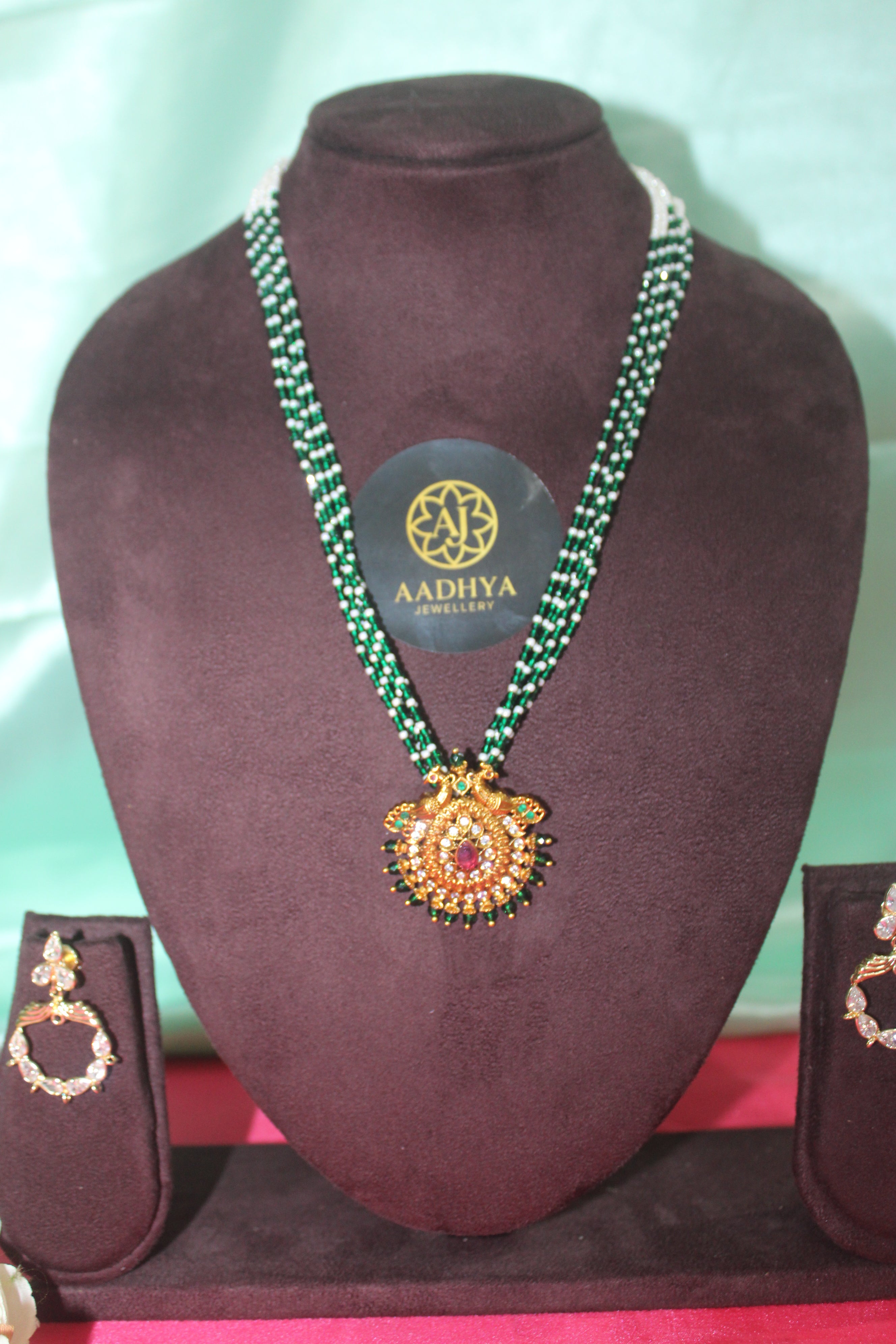 green crystal beads with sugar beads ,peacock pendent matching earings