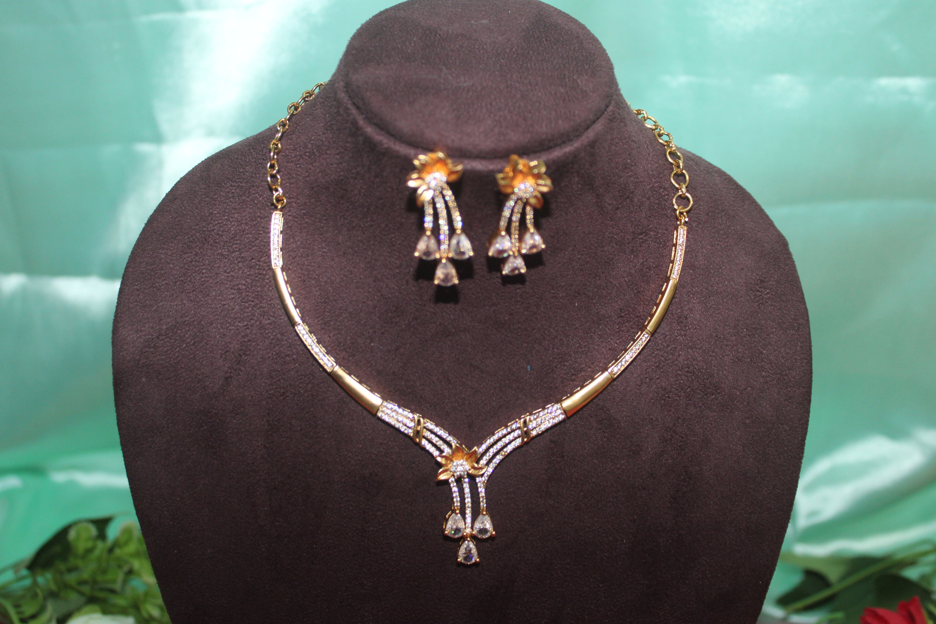 Modern necklace with american diamonds embedded in it u carve with earings