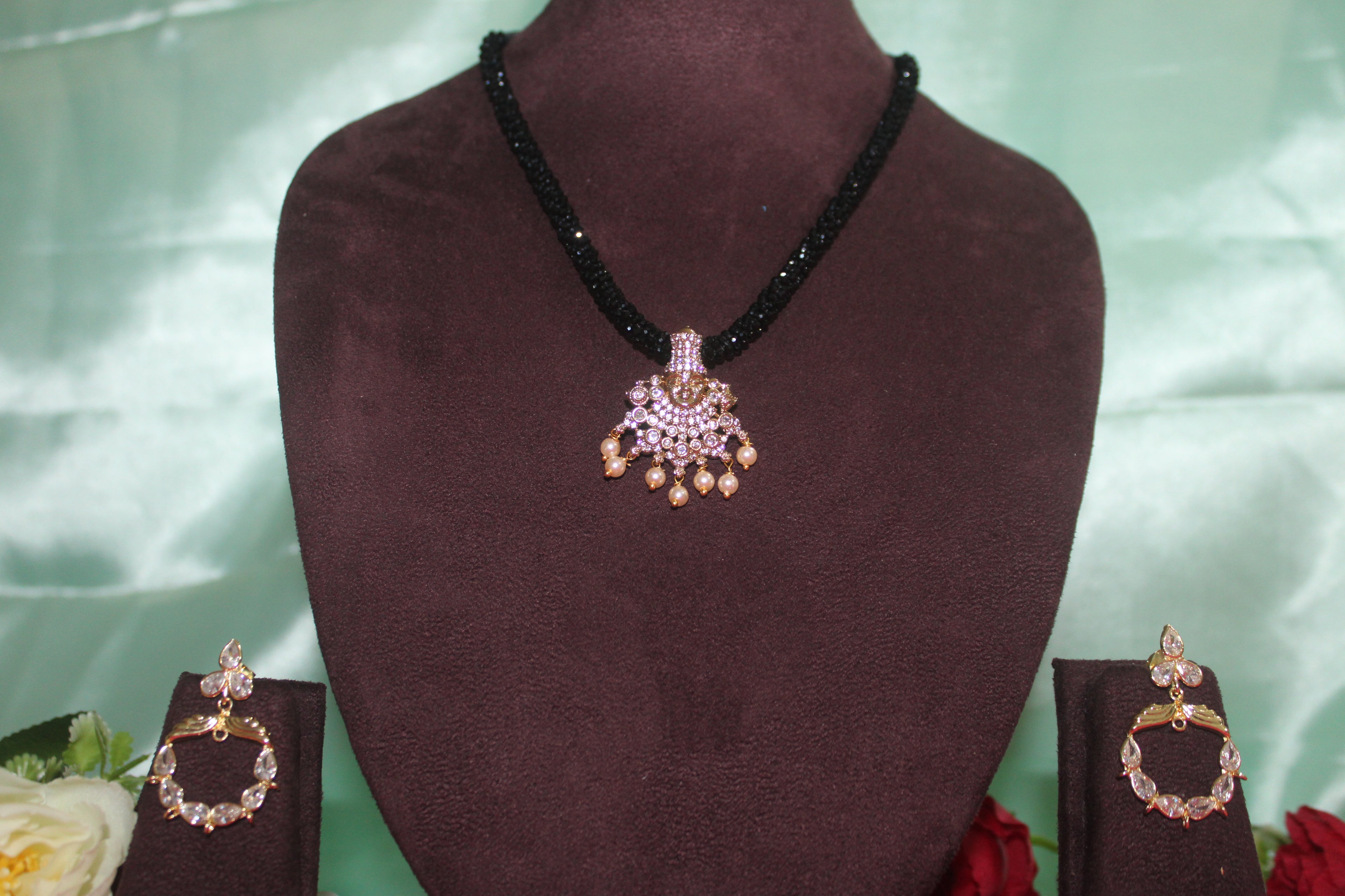 Black beads cz mala with lord venkateshwara diamonds embedded in it with matching earings