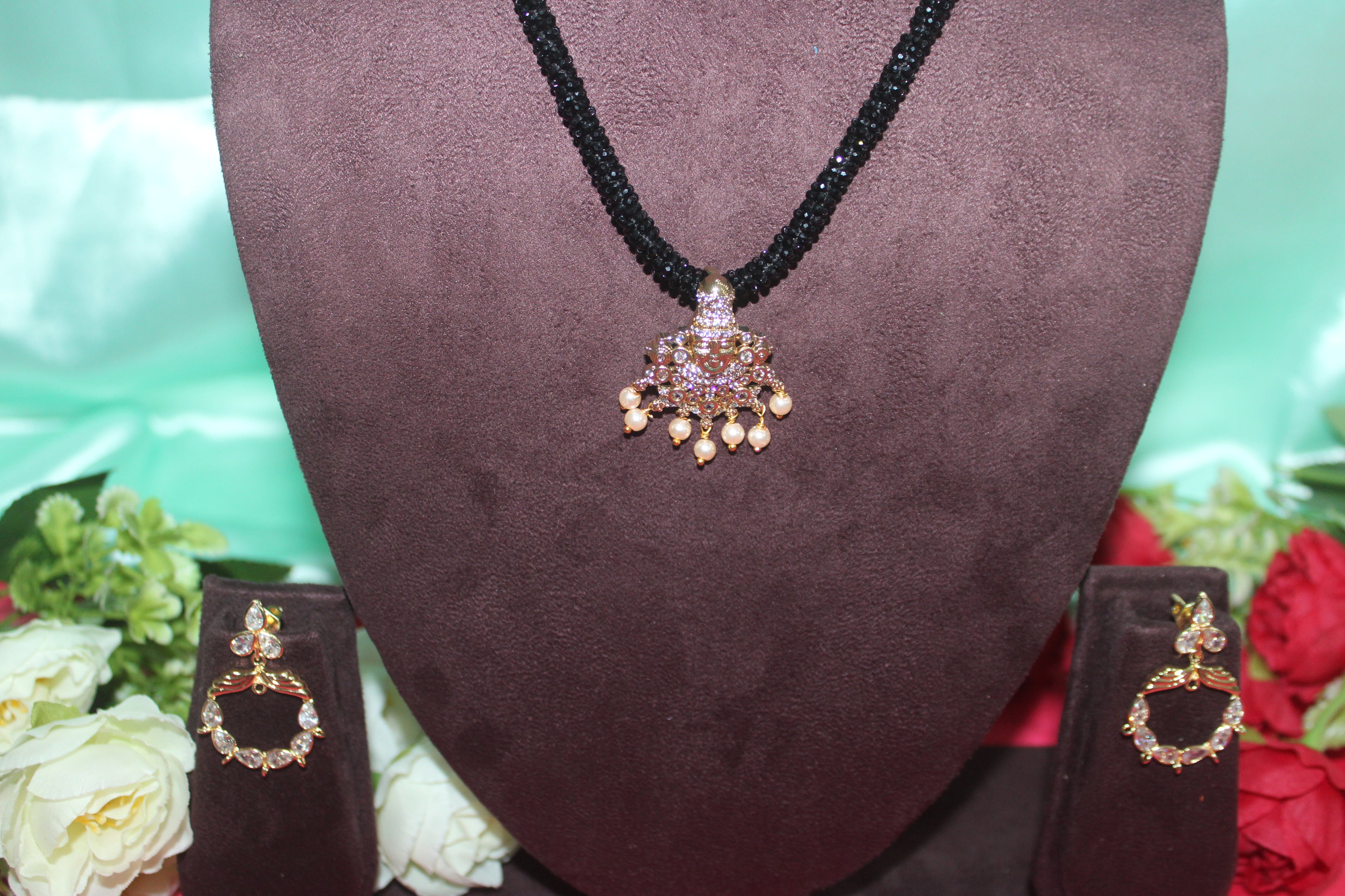 Black beads cz mala with lord venkateshwara diamonds embedded in it with matching earings
