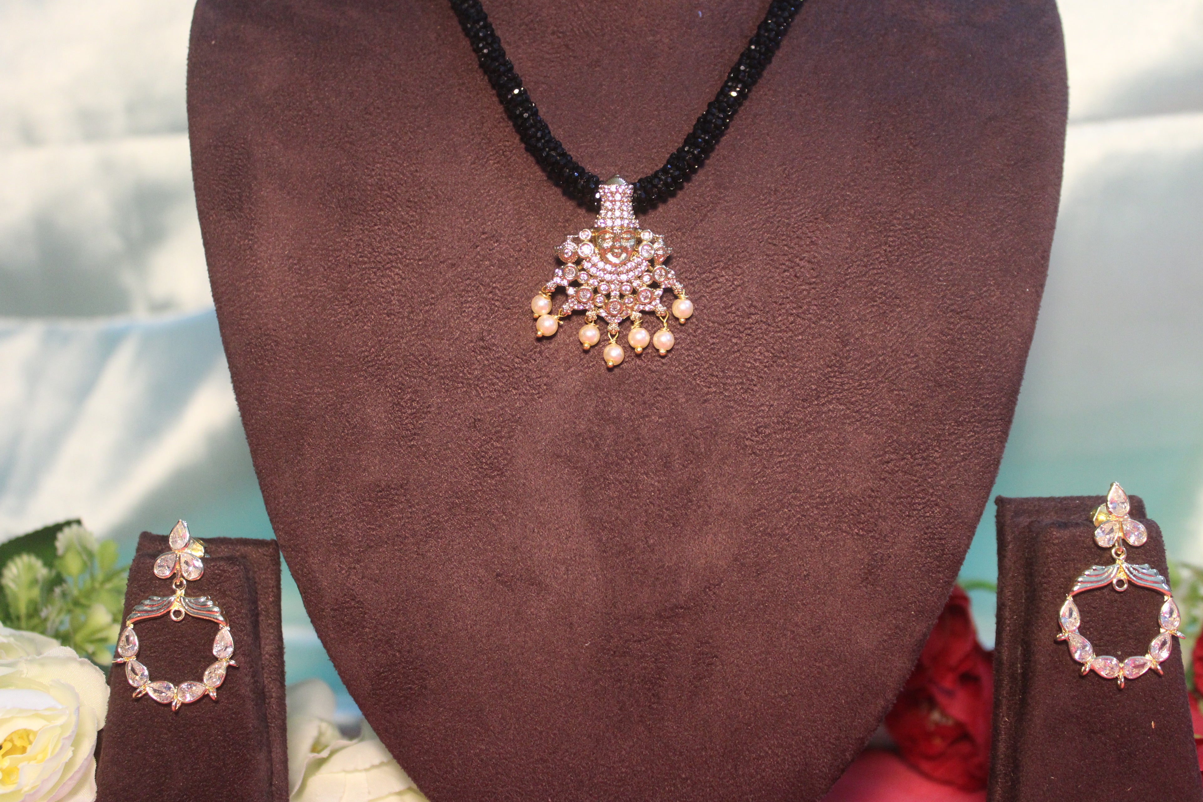 Black beads cz mala with lord venkateshwara diamonds embedded in it with matching earings